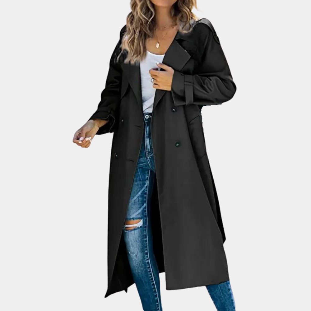 Black women's trench coat by Homixa with button details, featuring a classic fit and sleek design in the Freya Edit collection.