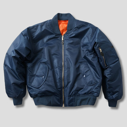 Women’s unisex classic bomber jacket in blue by Beckmiller, featuring a sleek design and front zipper.