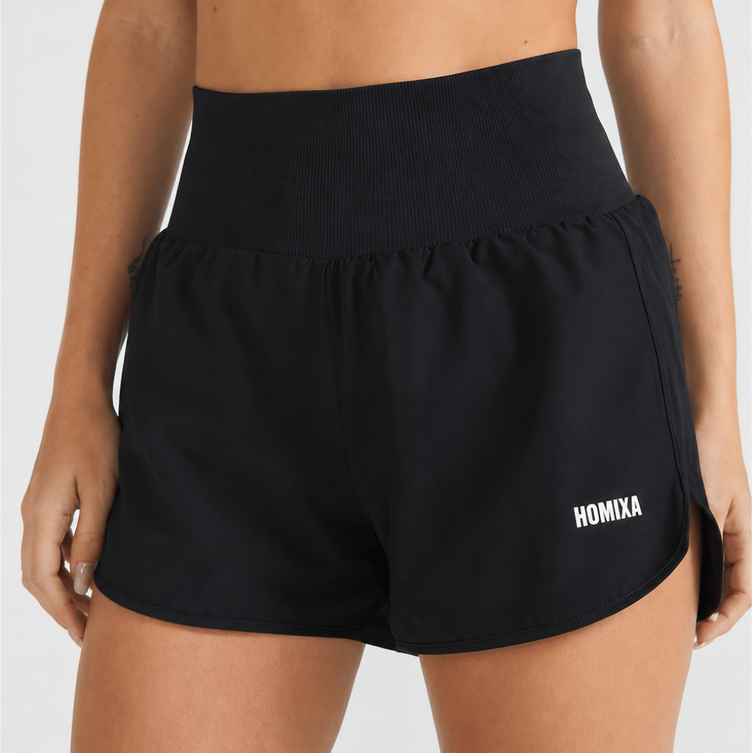 Black Homixa Sprint Ribbed Waist women's shorts displayed on a model, showcasing their fitted design and ribbed fabric.