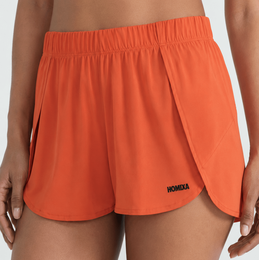 Homixa Sprint Air women's shorts in vibrant tangerine orange, lightweight athletic shorts with a comfortable fit.