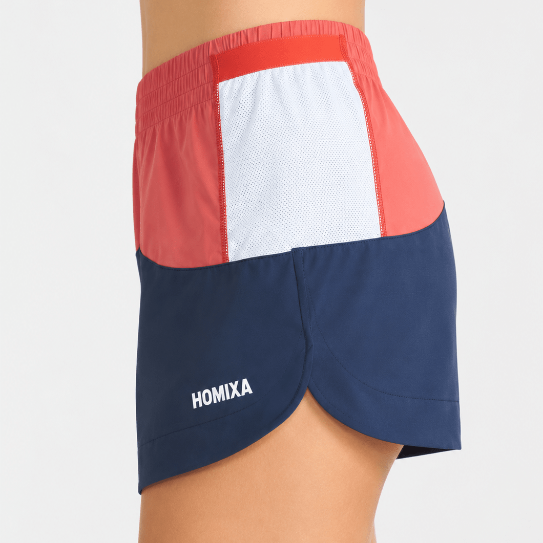 Homixa Sprint Color Block women's shorts in navy blue and coral, featuring a stylish, casual design with color blocking detail.