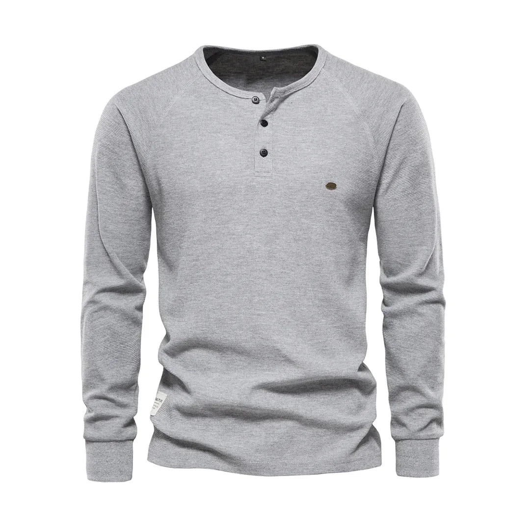 Homixa men's long sleeve shirt with button details, shown in a natural pose, featuring a classic collar and tailored fit.