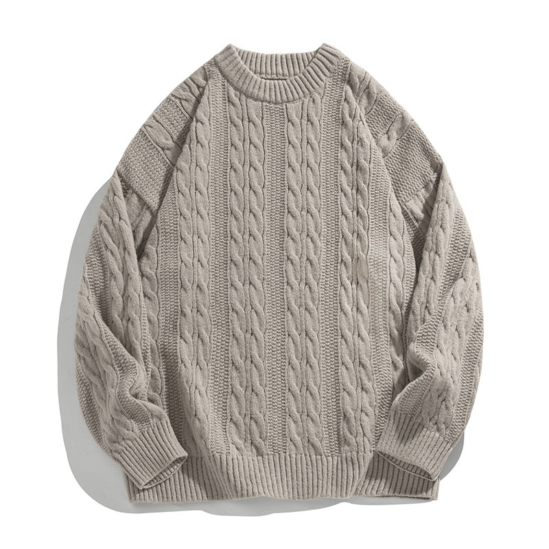 Homixa Arbury cable-knit crew-neck sweater with relaxed fit, dropped shoulders, and ribbed cuffs, displayed on a mannequin.