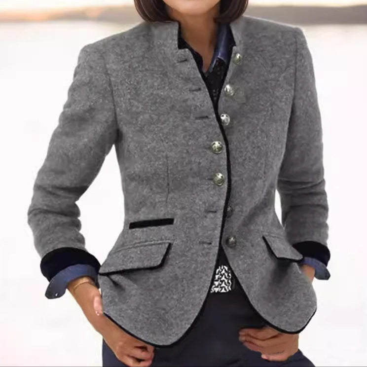Loppist Margaret classic wool blend blazer shown in navy with tailored fit and notched lapel on a hanger.