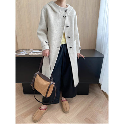 Homixa Bellenza women's mid-length hooded toggle coat with patch pockets and relaxed fit, front toggle closure, overcoat style.