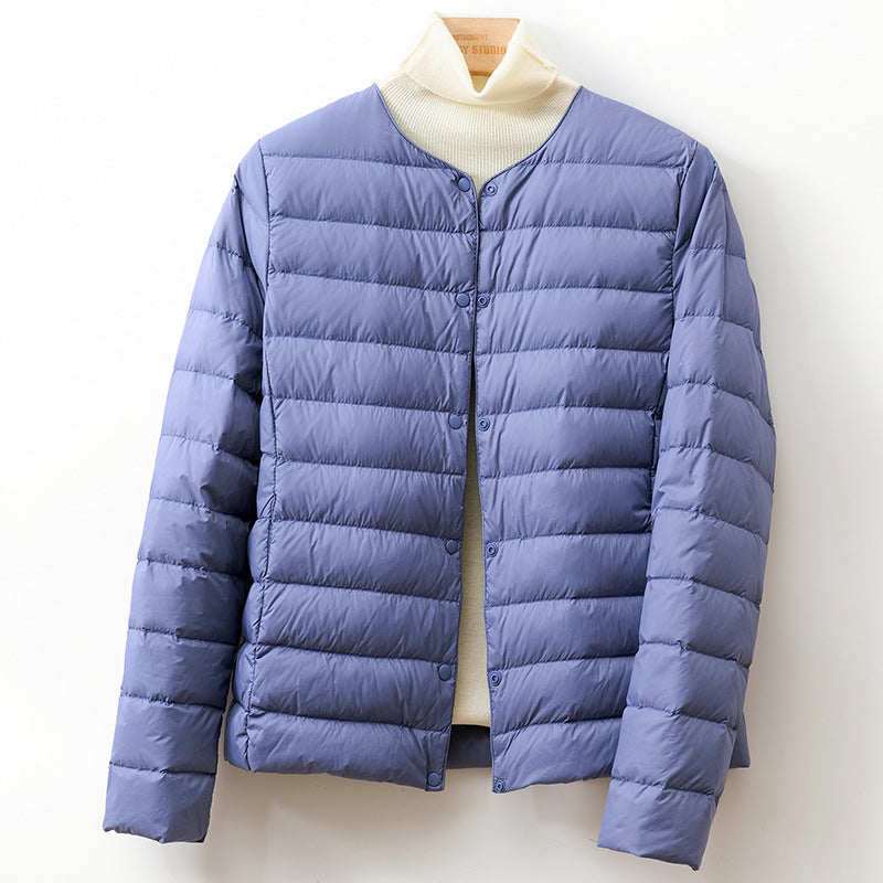 Jack Hafford Helga Down Puff Jacket in black, featuring a quilted design and hood, displayed on a mannequin.