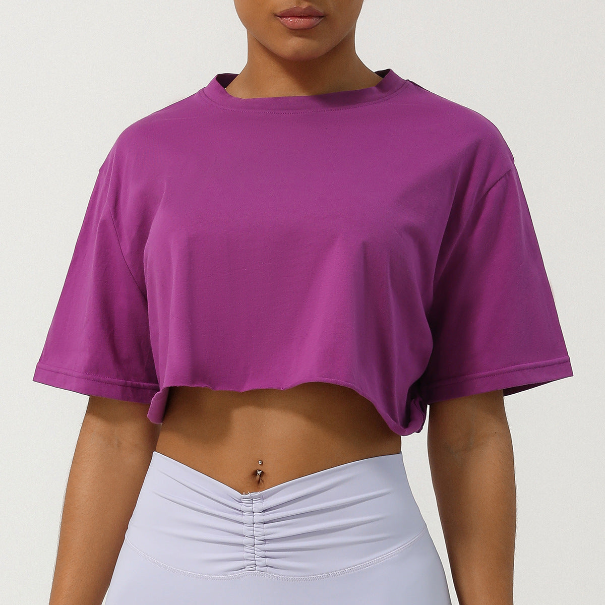 Loppist CASSIA™ relaxed fit crop tee in white, casual short-sleeve shirt with round neckline and cropped length, styled on a hanger.