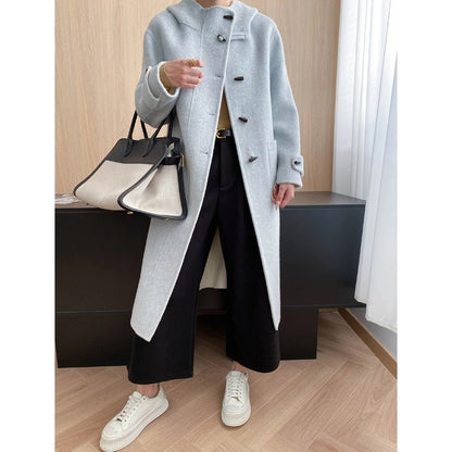 Homixa Bellenza women's mid-length hooded toggle coat with patch pockets and relaxed fit, front toggle closure, stylish overcoat.