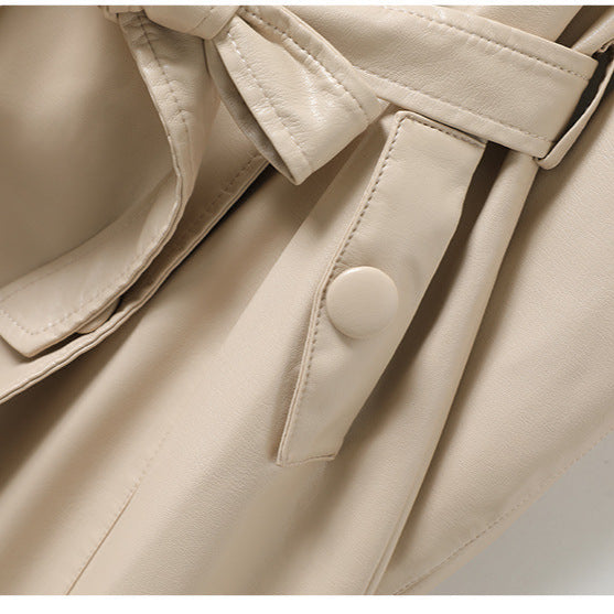 Jack Hafford Chelsea sheepskin leather trench coat hanging on a rack with a classic design and rich leather texture.