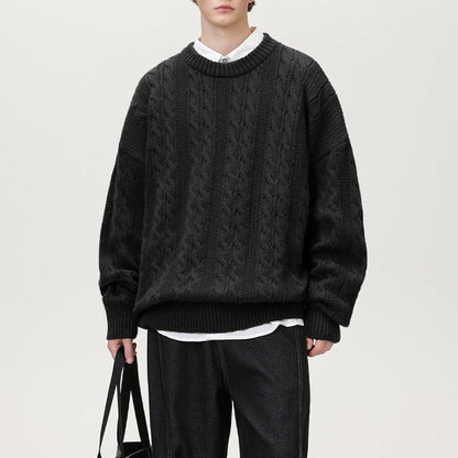 Homixa Arbury cable-knit crew-neck sweater with relaxed fit, dropped shoulders, and ribbed cuffs, displayed on a neutral background.