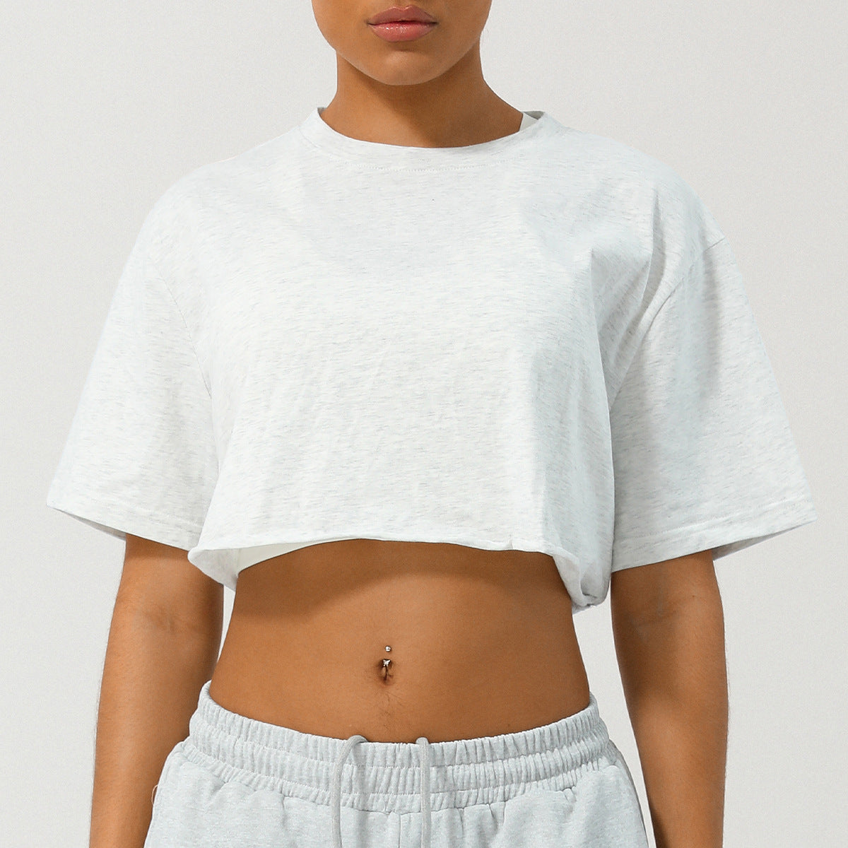 Loppist CASSIA™ relaxed fit crop tee in soft fabric, displayed on a hanger with a casual, laid-back style.