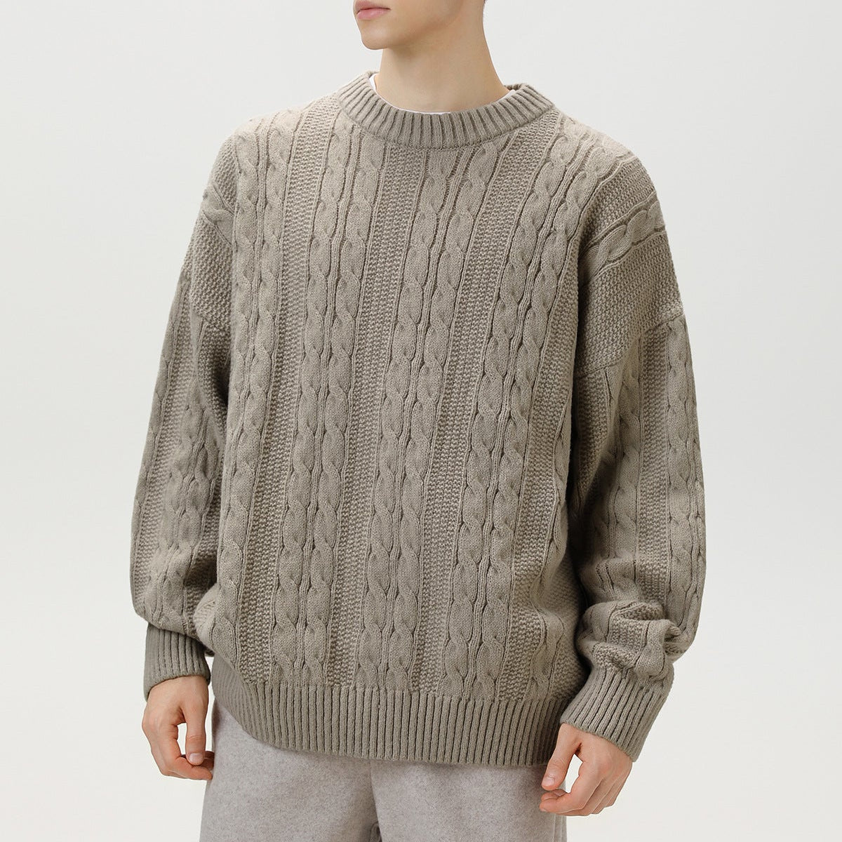 Homixa Arbury cable-knit crew-neck sweater with relaxed fit, dropped shoulders, and ribbed cuffs, featuring a cozy textured knit.