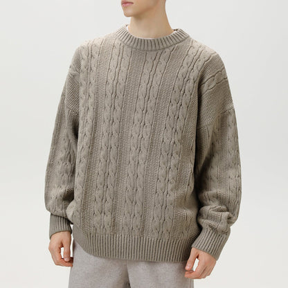 Homixa Arbury cable-knit crew-neck sweater with relaxed fit, dropped shoulders, and ribbed cuffs, featuring a cozy textured knit.