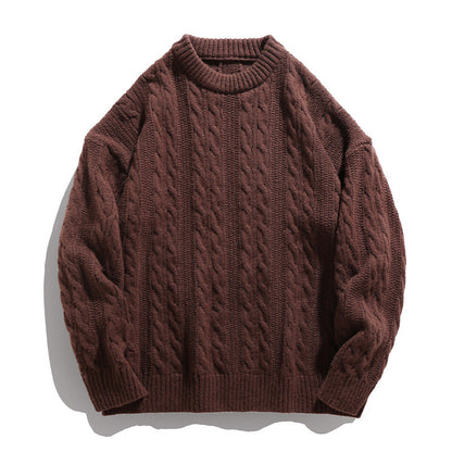 Homixa Arbury cable-knit crew-neck sweater with relaxed fit, dropped shoulders, and ribbed cuffs, shown in a cozy knit texture.
