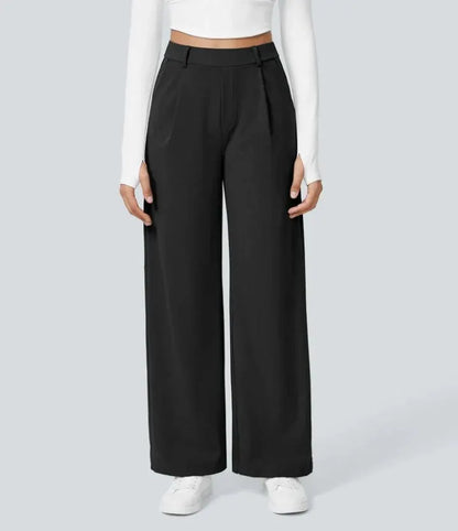 Homixa Anya women's high-waisted wide leg pants with relaxed fit and flowing fabric, shown in a stylish, natural pose.