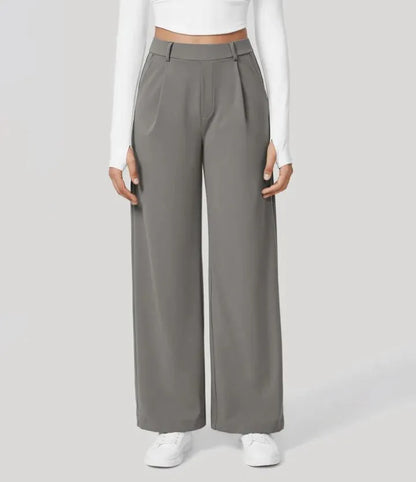 Homixa Anya women's high-waisted wide leg pants with relaxed fit and flowing fabric, shown on a model.
