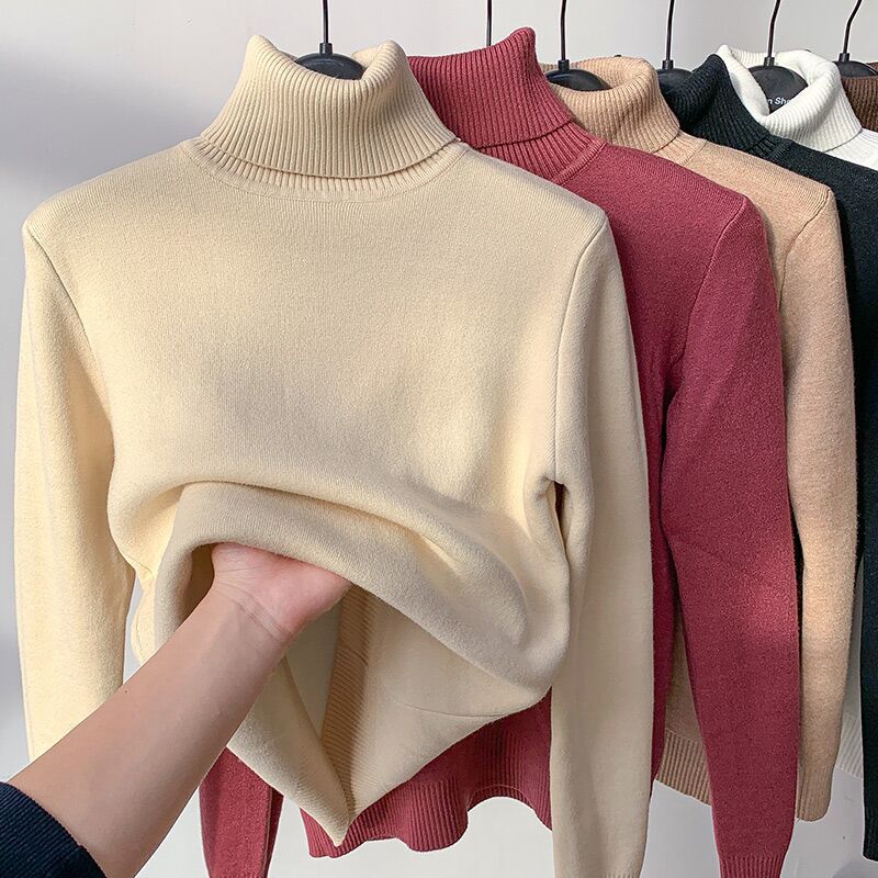 Homixa women's turtleneck sweater with sherpa detailing, showcasing soft fabric and cozy style in a close-up view.