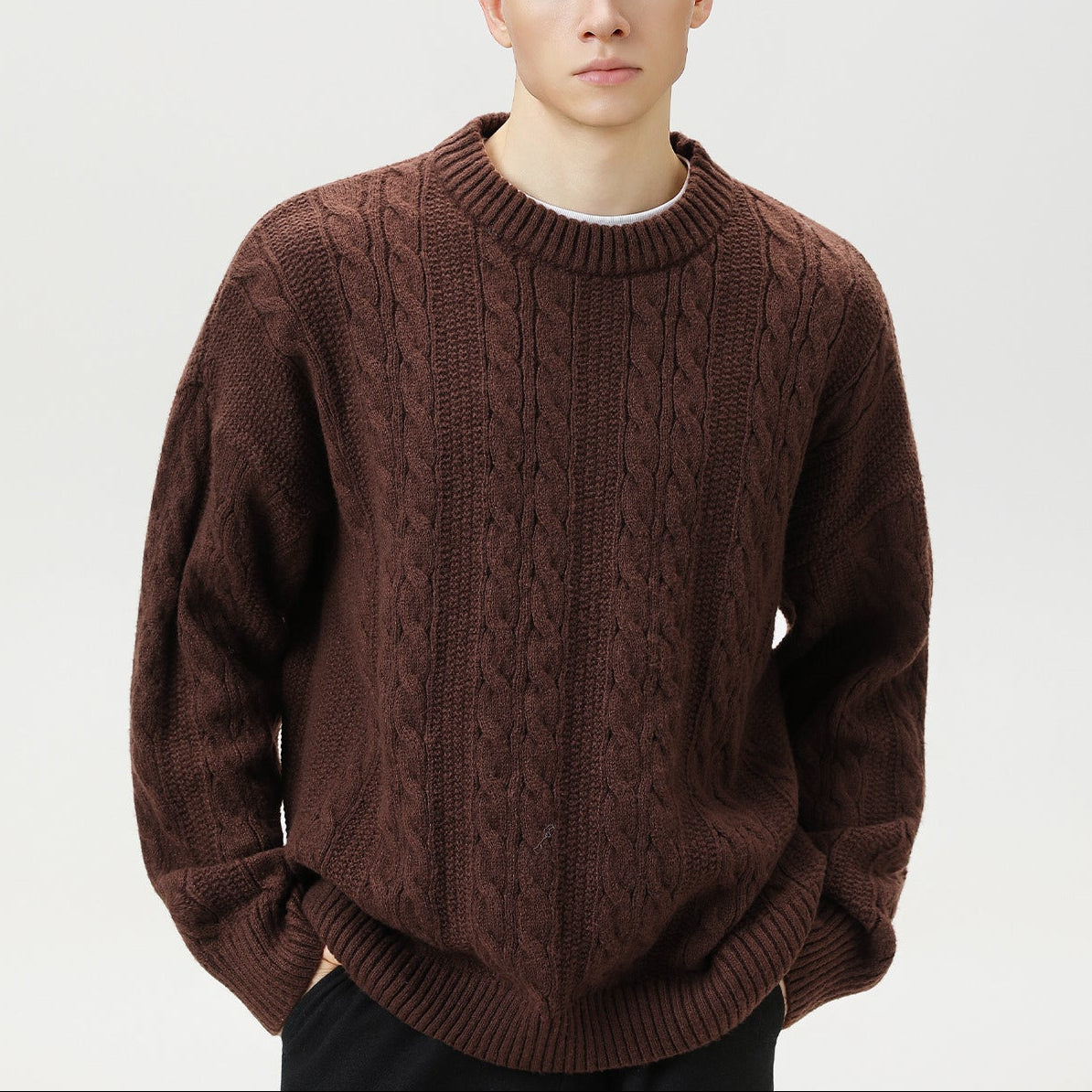 Homixa Arbury cable-knit crew-neck sweater with relaxed fit, dropped shoulders, and ribbed cuffs, shown in a cozy knit design.
