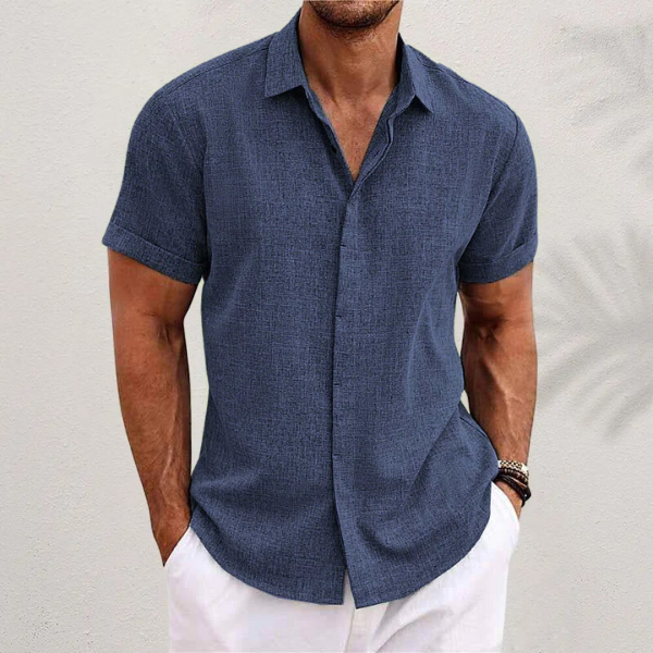 Homixa Caelenza classic short-sleeve dress shirt with textured finish, collar, and curved hem, displayed on a hanger.