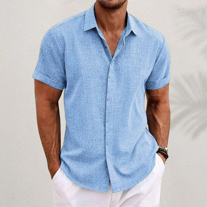 Homixa Caelenza classic short-sleeve dress shirt with textured finish, collared neckline, and curved hem, displayed on a mannequin.