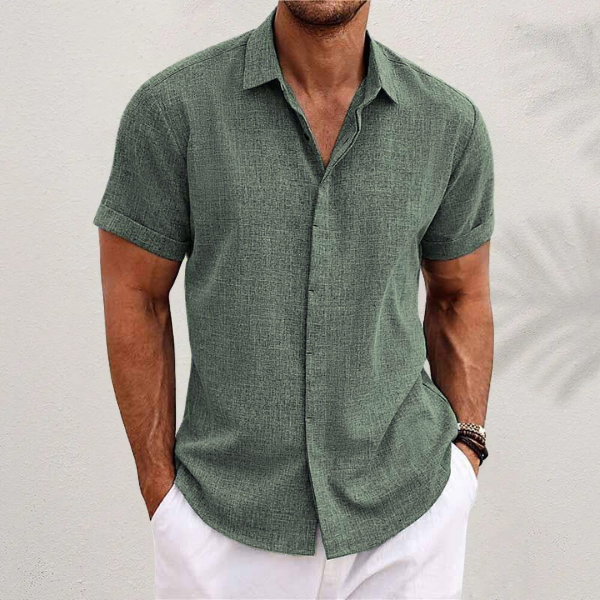 Homixa Caelenza classic short-sleeve dress shirt with textured finish, collared design, and curved hem, displayed on a hanger.