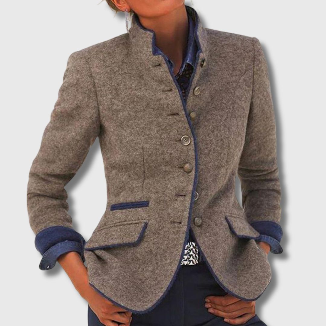 Loppist Margaret classic wool blend blazer, tailored fit with notch lapels, in neutral gray fabric, displayed on a hanger.