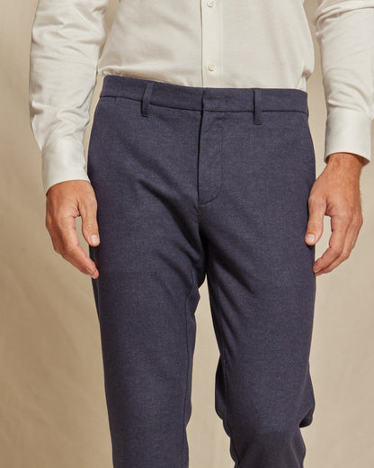 Men's navy blue brushed stretch chino pants in slim fit by Olive & Evy, showing the tailored fit and fabric texture.