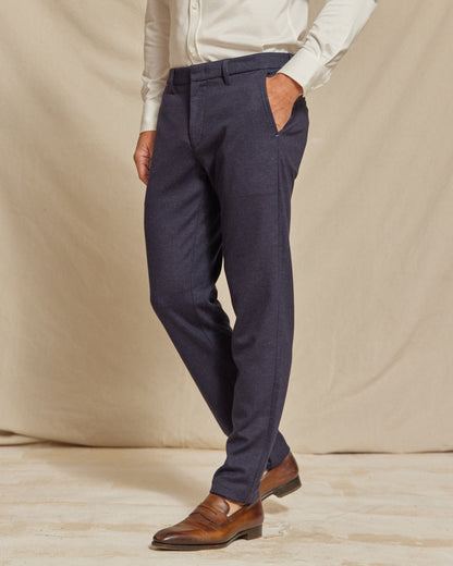 Men's navy blue brushed stretch chino pants by Olive & Evy, slim fit with a tailored design, shown on a model.