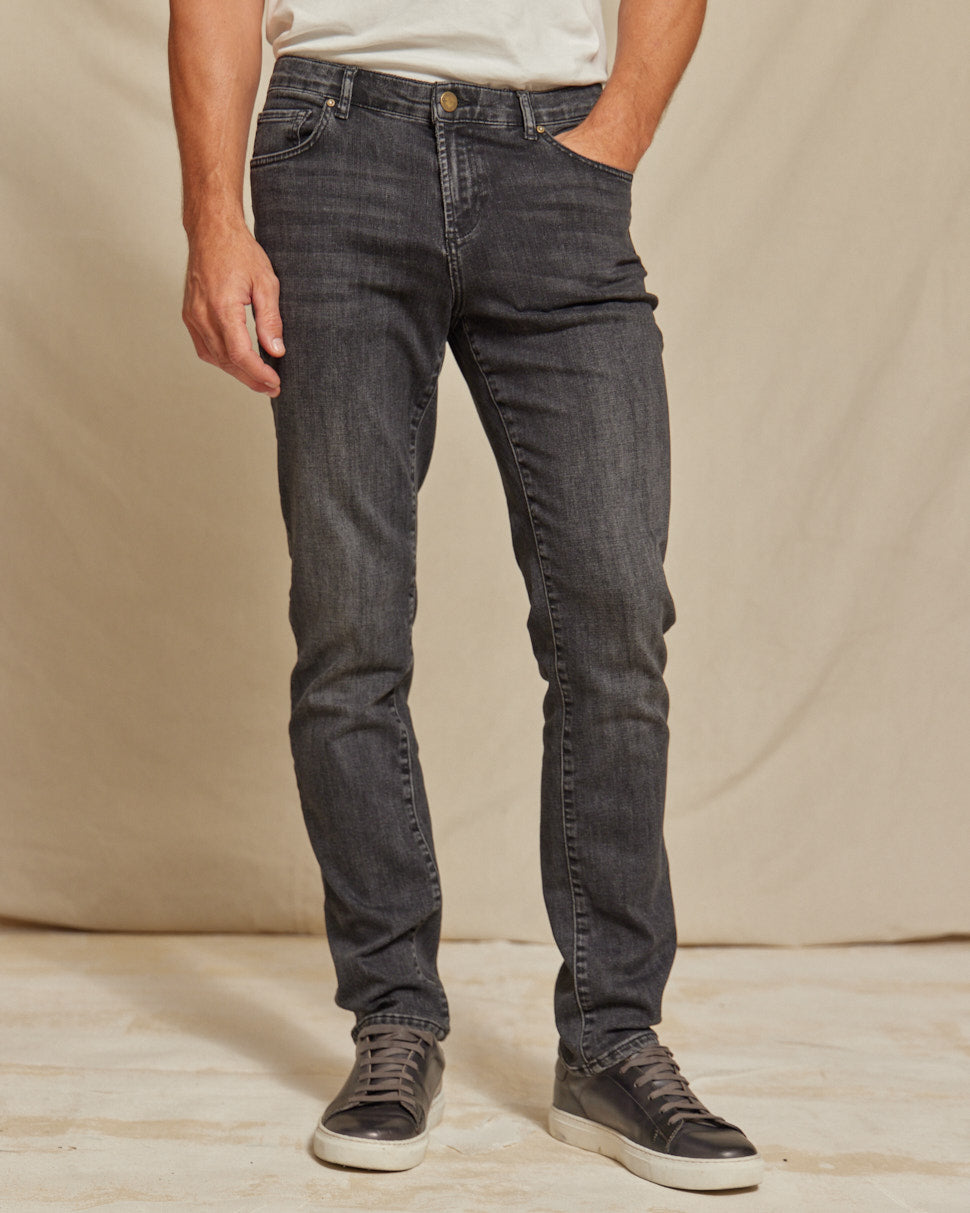 Men's stretch denim jeans by Olive & Evy featuring a durable fit and 4-way performance in a classic denim style.