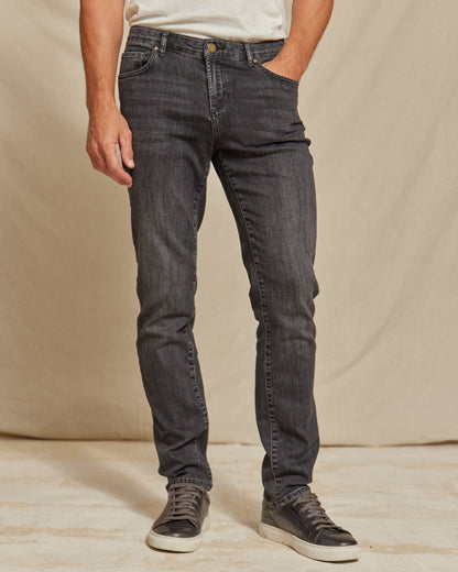 Men's stretch denim jeans by Olive & Evy featuring a durable fit and 4-way performance in a classic denim style.