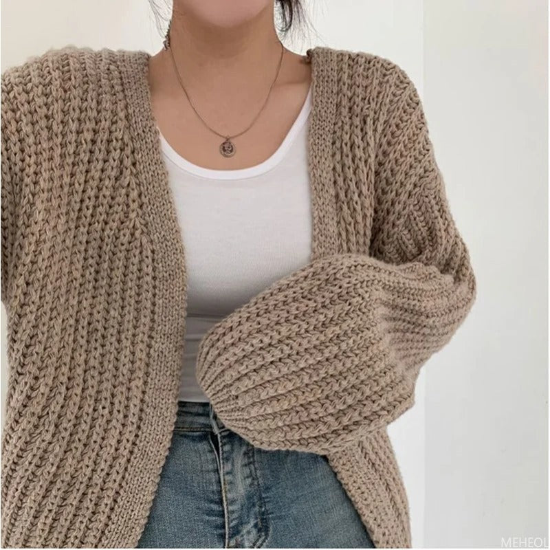 Homixa chunky-knit women's cardigan featuring a cozy, stylish knit design with a button-up front and long sleeves.