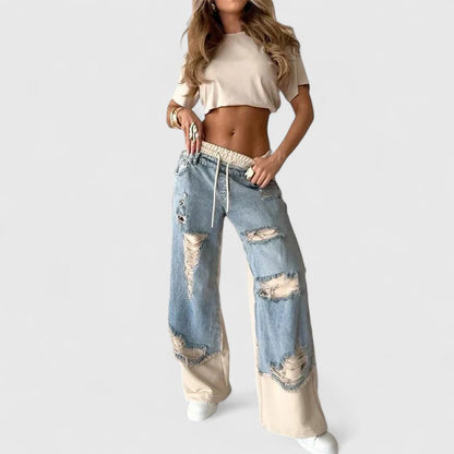 Comfortable Mercer & Bloom Isolenyrah sweatpants in soft fabric, shown on a model with a relaxed fit and elastic waistband.