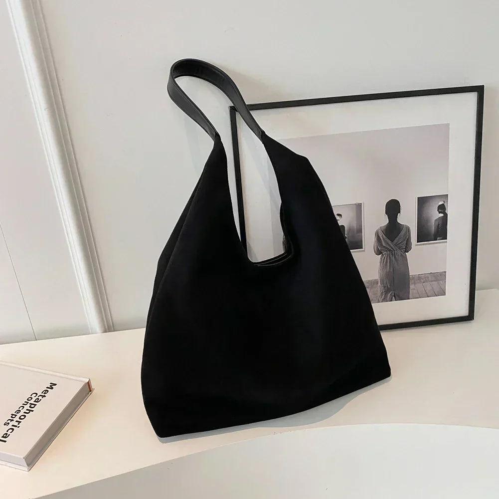 Homixa women's tote bag with pocket detail, stylish and spacious for daily use, in a neutral color with sturdy handles.