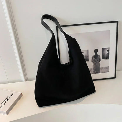 Homixa women's tote bag with pocket detail, stylish and spacious for daily use, in a neutral color with sturdy handles.