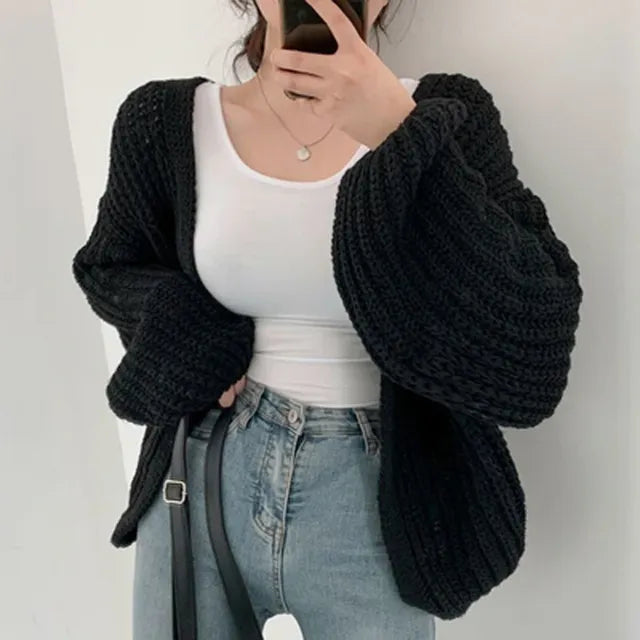 Homixa women's chunky-knit cardigan with long sleeves and button closure, cozy and stylish for layered winter looks.