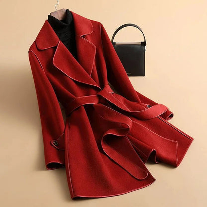 Jack Hafford Jennie Trench Coat displayed on a model, featuring a classic beige design with a belted waist and tailored fit.
