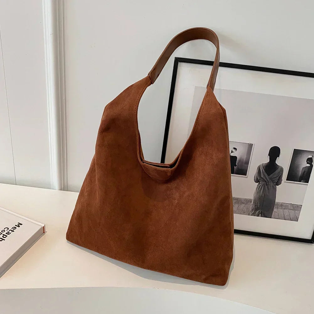 Homixa tote bag for women with pocket detail, stylish and spacious accessory for everyday use, showcasing the bag's design and fabric.