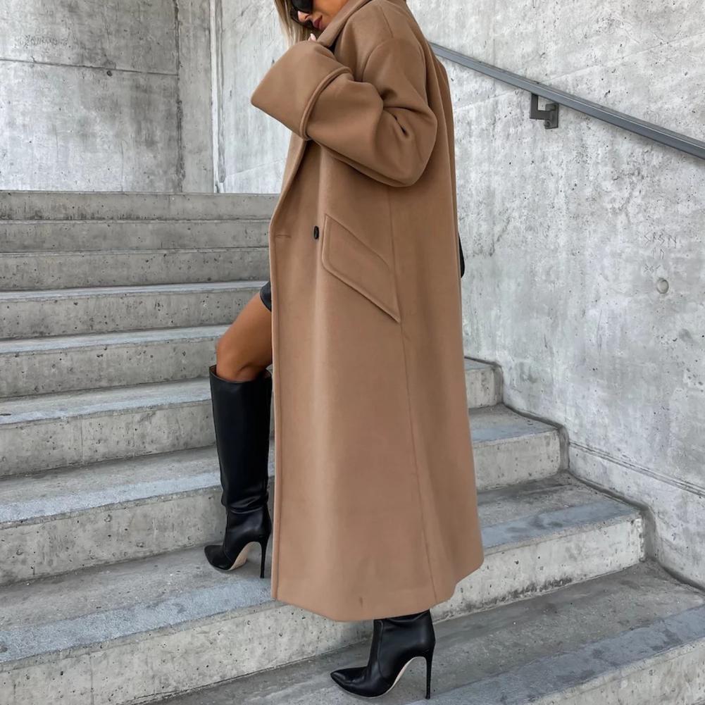 Women’s trench coat by Homixa featuring classic beige fabric, belted waist, and tailored fit for layered stylish look.