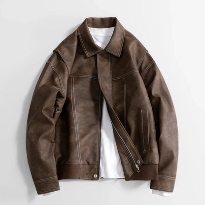 Black Rothwell leather jacket by Jack Hafford hanging on a wooden hanger with visible stitching and smooth leather texture.