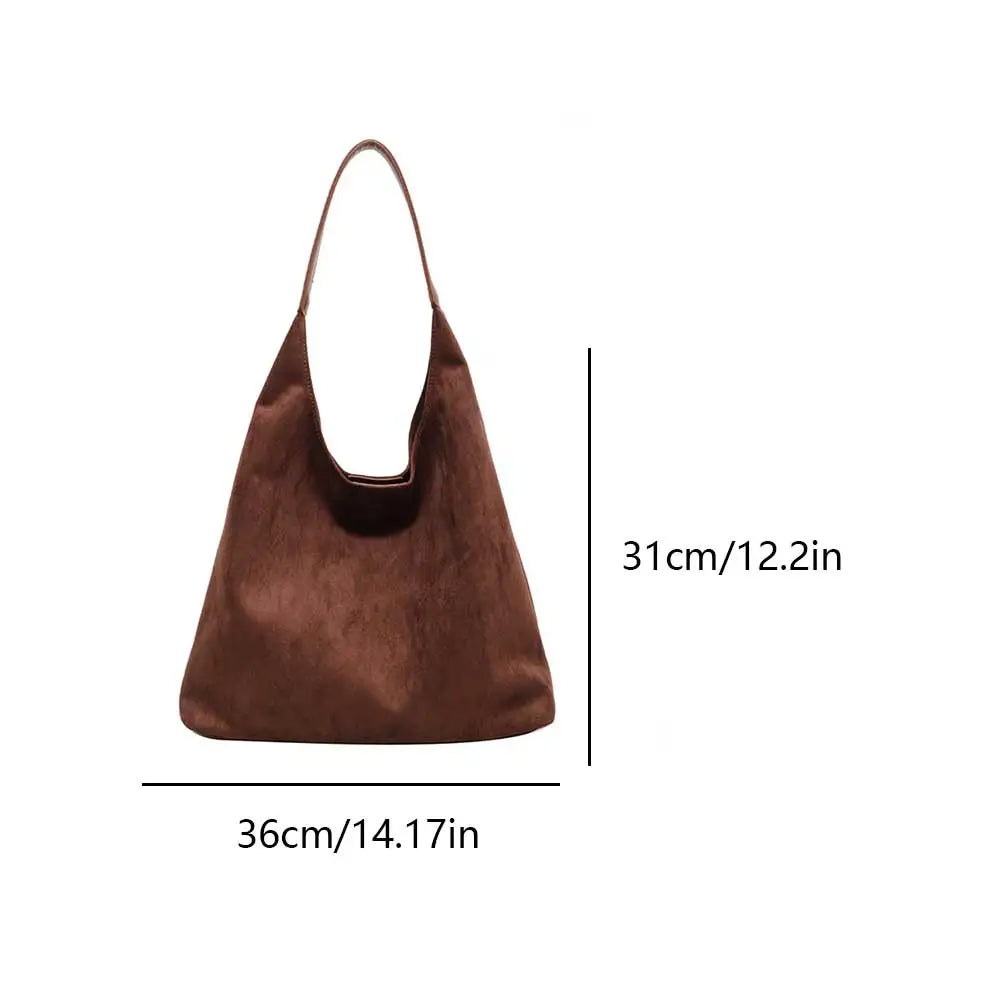 Homixa tote bag for women with pocket detail, showcasing the spacious design and stylish exterior in natural light.