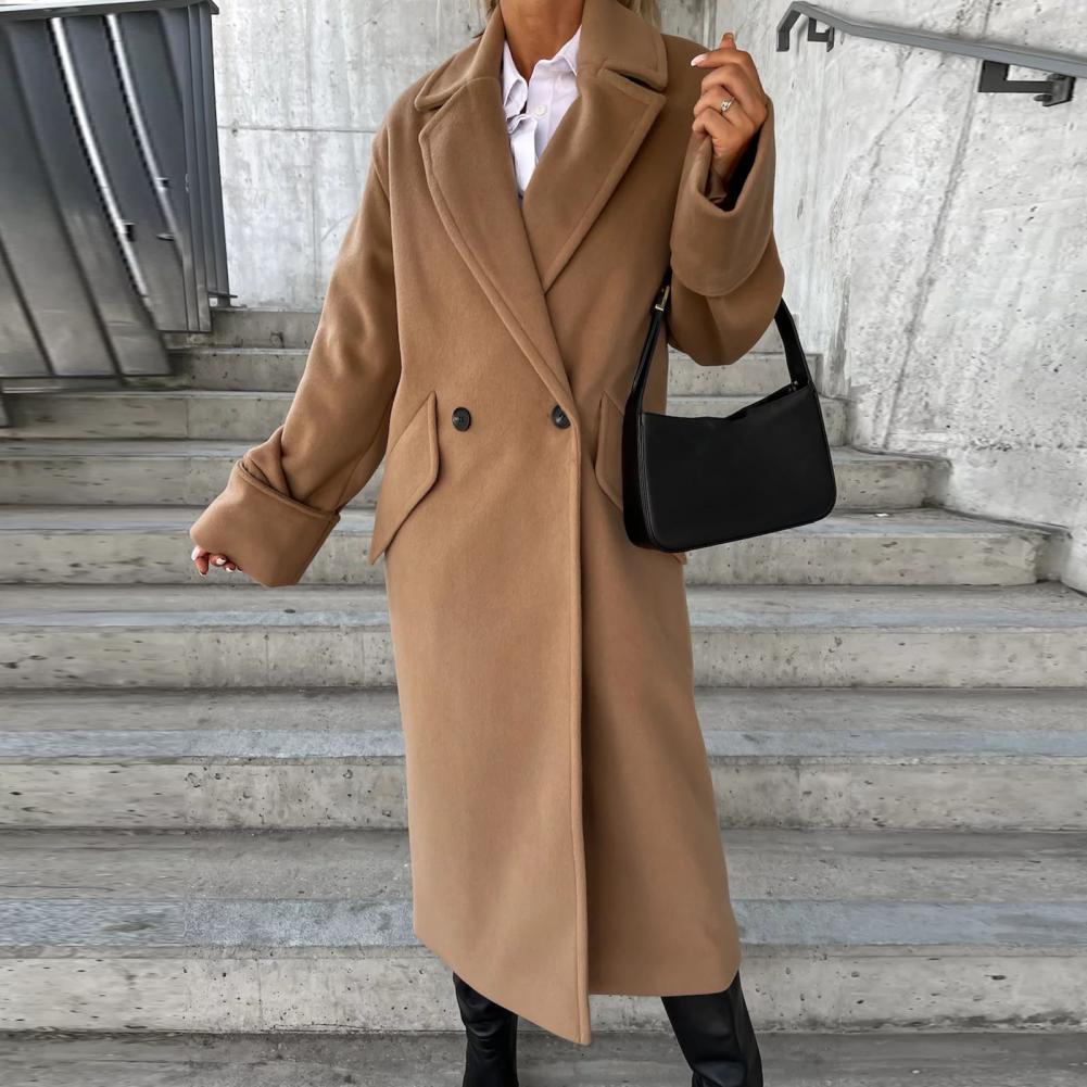 Woman wearing a classic beige Homixa trench coat, stylish layering piece with a belt and tailored fit for versatile fashion.