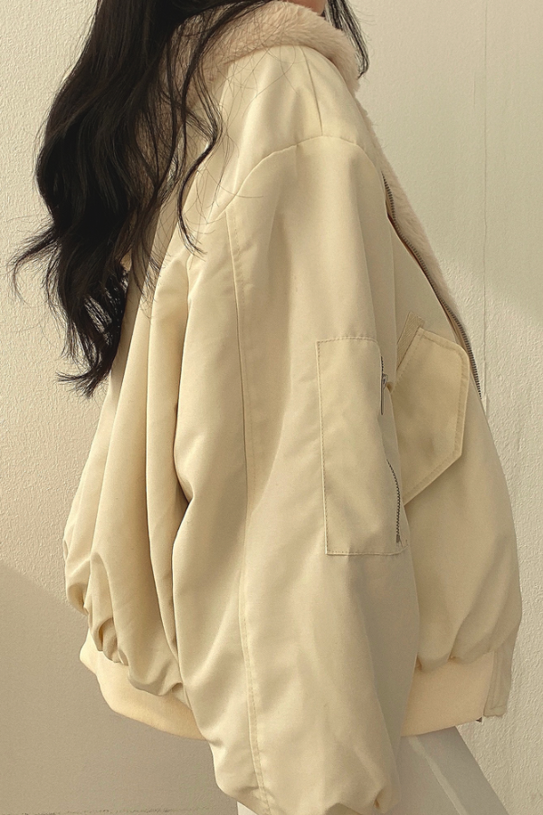 Homixa women's oversized winter bomber jacket with faux fur hood, relaxed fit, and stylish design, suitable for cold weather.
