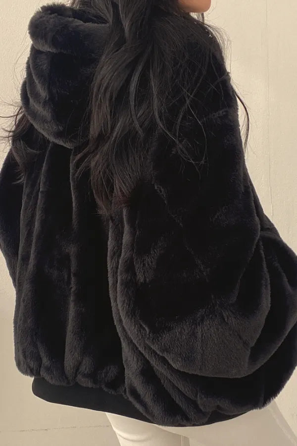 Homixa women's oversized bomber jacket with faux fur hood, relaxed fit, stylish winter outerwear featuring a comfortable, trendy design.