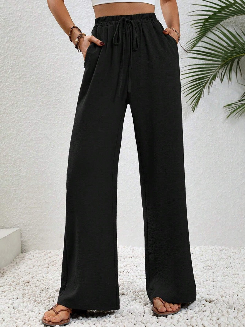 Dobrina draped wide-leg tailored women's trousers by Kate and Wendy, featuring a sophisticated, flowing design and structured fit.