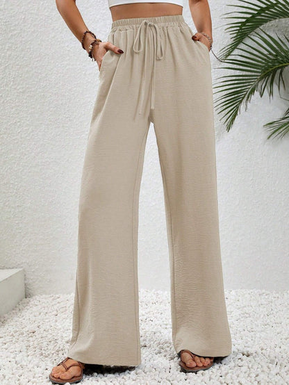 Kate and Wendy Dobrina draped wide-leg tailored women's trousers, featuring a stylish and comfortable design.