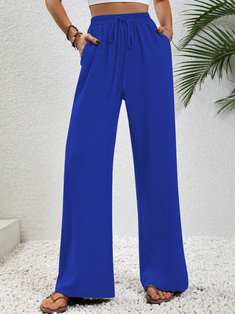 Dobrina draped wide-leg tailored women's trousers by Kate and Wendy, featuring a relaxed fit and elegant draping style.
