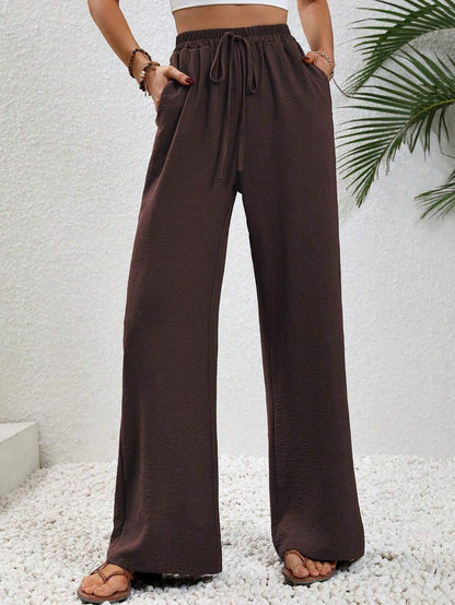 Dobrina draped wide-leg tailored women's trousers by Kate and Wendy, featuring a relaxed fit and sophisticated design.