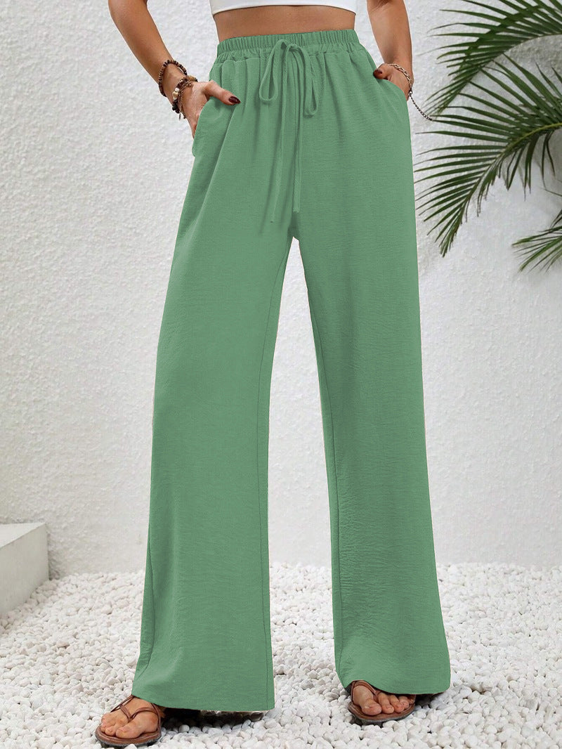 Kate and Wendy Dobrina draped wide-leg tailored women's trousers, featuring a relaxed fit and elegant draped design.