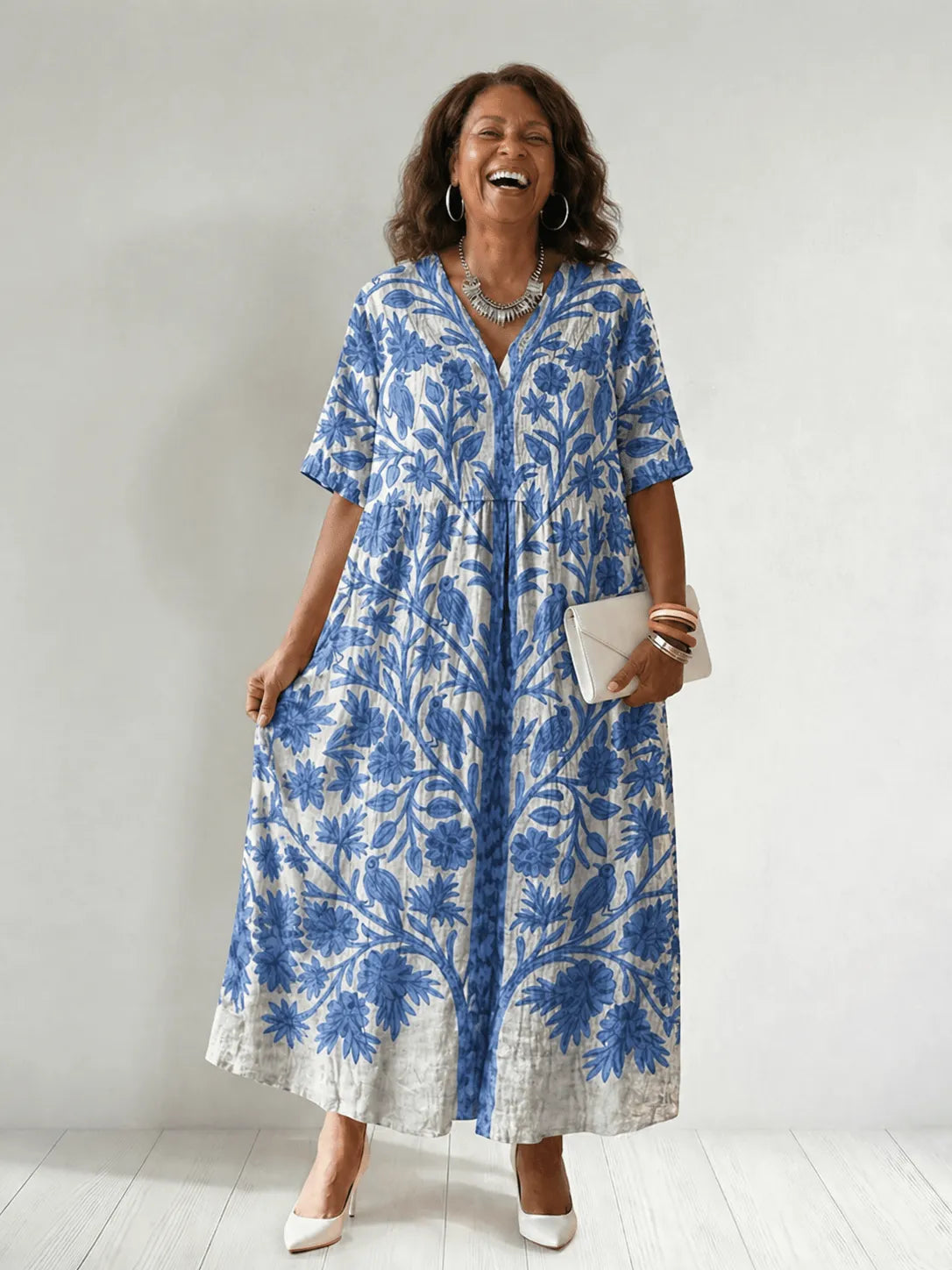Homixa women's floral-print V-neck maxi dress displayed on a model, showcasing the flowy fabric and vibrant floral pattern.