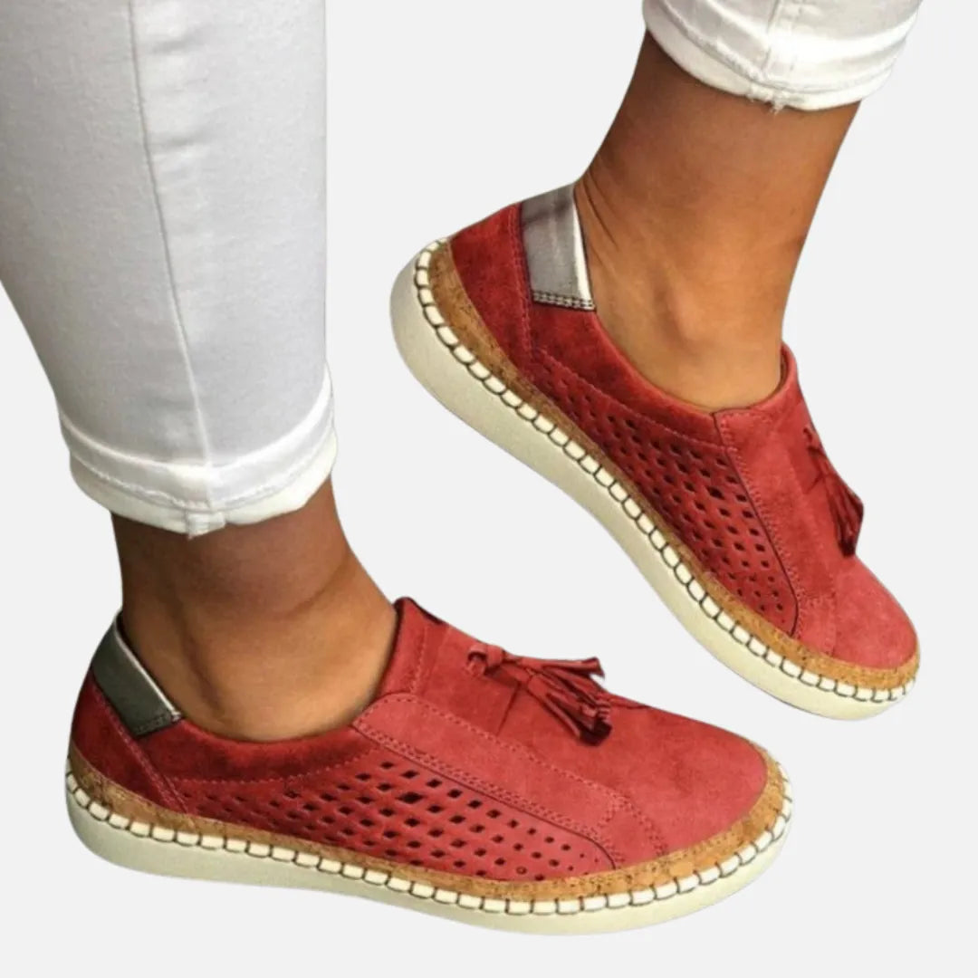 Homixa women's perforated slip-on shoes with tassel detail, showcasing breathable design and stylish comfort.